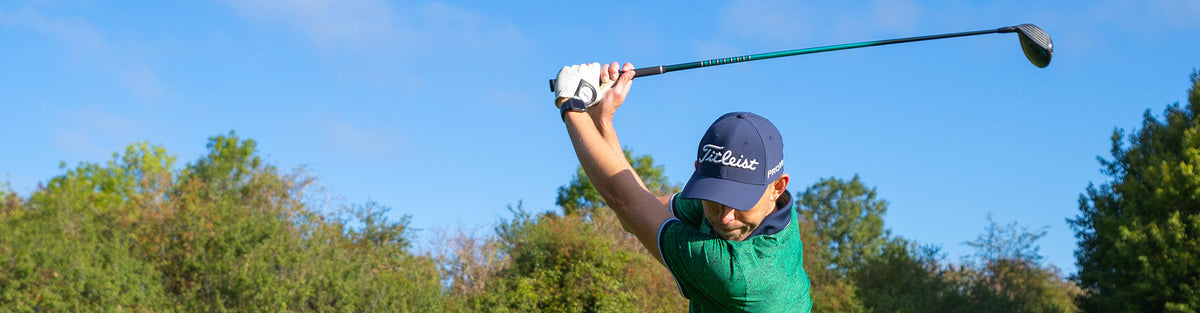 a golfer with a close up look of the polo shirt for men